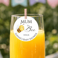Load image into Gallery viewer, Mum To Bee edible drink topper on a champagne glass at a baby shower celebration.