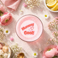Load image into Gallery viewer, Edible drink toppers for cocktails featured in a glass with pink drink and floral decorations.