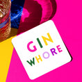 Load image into Gallery viewer, Bright and playful Gin Whore Drink Coaster on a vibrant background with a glass of drink.