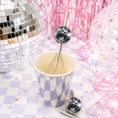 Load image into Gallery viewer, Disco ball paper party straw toppers in a cup surrounded by disco balls and party decorations.