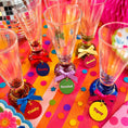 Load image into Gallery viewer, Tipsy Quotes Wine Glass Charm Set Of 6 displayed on colorful table with vibrant charms and glasses