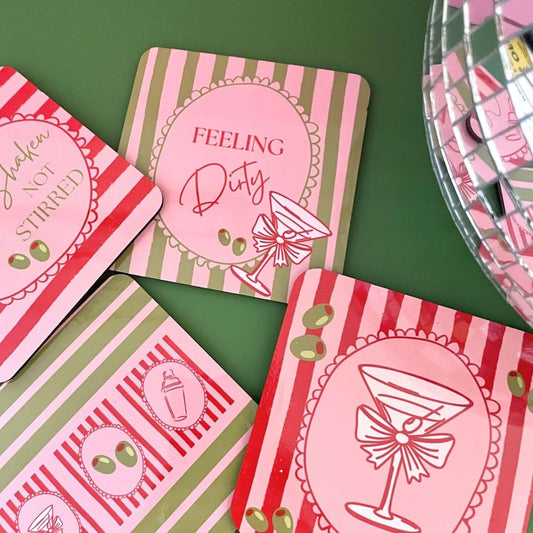 Feeling Dirty martini drink coasters set of 4 with colorful designs and cocktail illustrations.