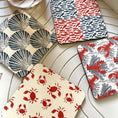 Load image into Gallery viewer, Salty Days-Coastal Drink Coasters -Set of 4 featuring vibrant shell, lobster, crab, and fish designs.
