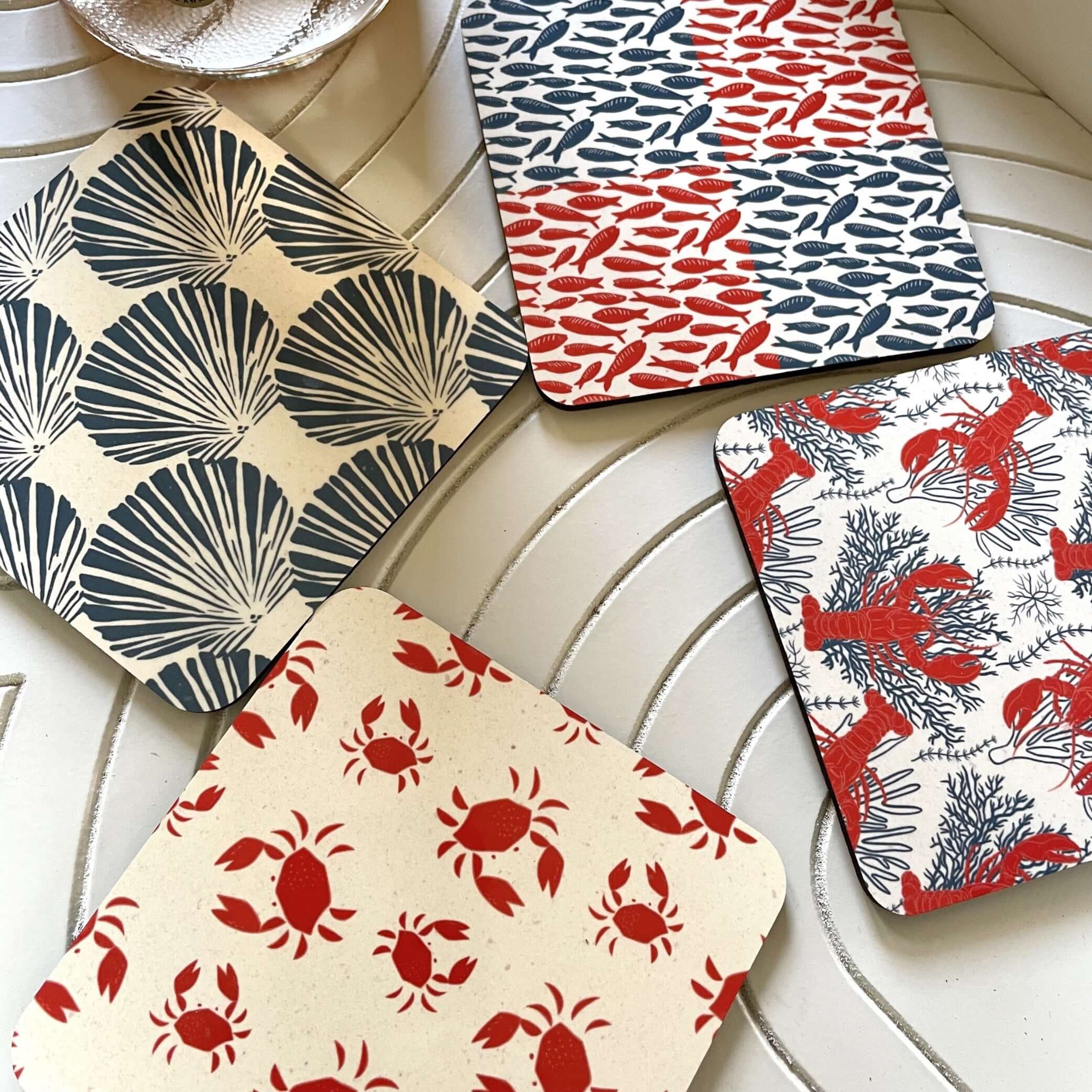 Salty Days-Coastal Drink Coasters -Set of 4 featuring vibrant shell, lobster, crab, and fish designs.