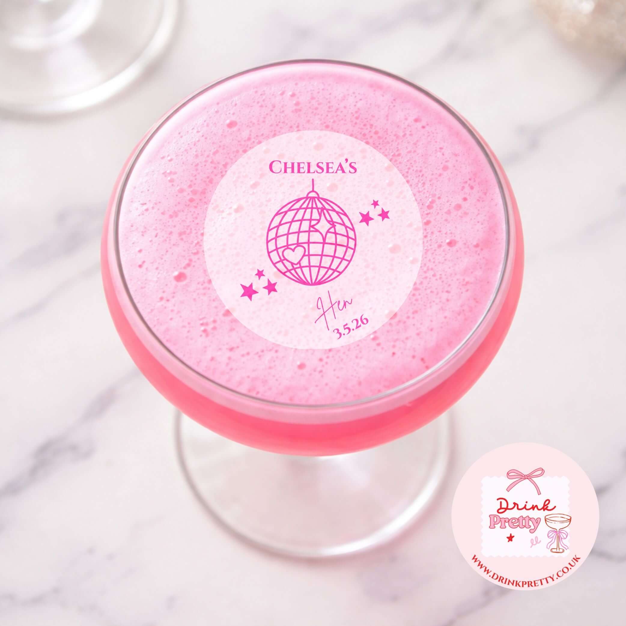 Edible drink toppers for hen parties disco ball on a pink cocktail for a bridal shower decoration.