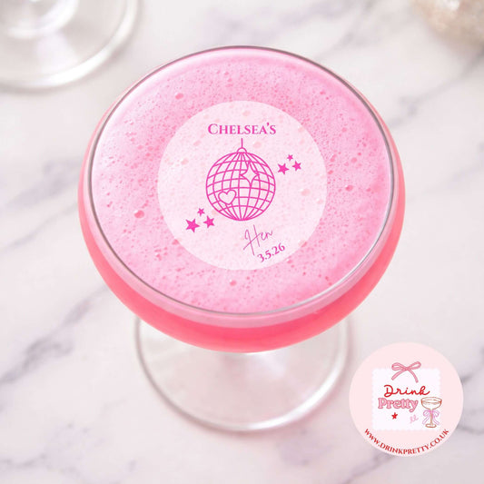 Edible drink toppers for hen parties disco ball on a pink cocktail for a bridal shower decoration.
