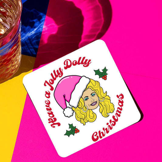 Have a jolly dolly Christmas drink coaster with colorful design and playful Dolly Parton illustration.