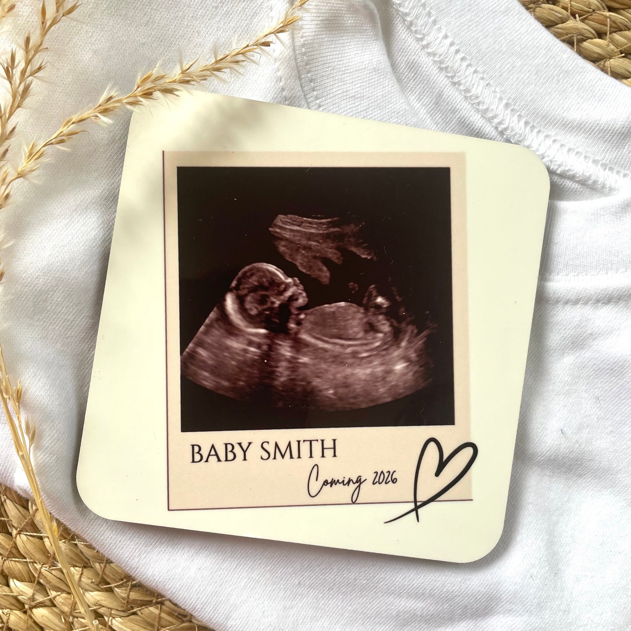 Baby scan coasters featuring a baby ultrasound photo with the name Baby Smith and the text 'Coming 2026'.