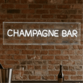 Load image into Gallery viewer, Champagne bar neon sign pre-order displayed on a brick wall, perfect for celebrations and home bars.
