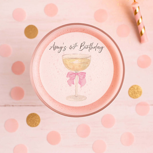 Sip & Celebrate Edible Cocktail Toppers on a pink birthday cocktail with decorative confetti.