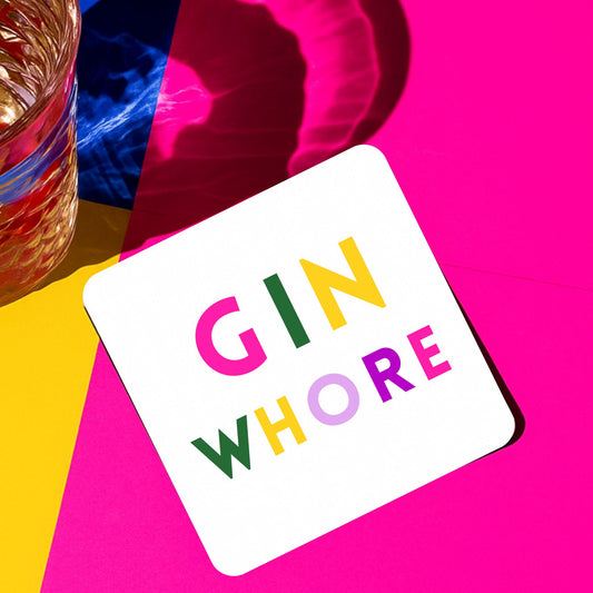 Bright and playful Gin Whore Drink Coaster on a vibrant background with a glass of drink.