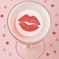 Load image into Gallery viewer, Valentine's drink toppers featuring red lips design on a cocktail surrounded by heart-shaped confetti.
