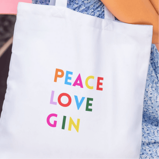Gin tote bag featuring colorful text saying 'PEACE LOVE GIN' on a white background, perfect for gin lovers.