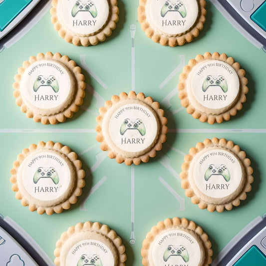 Level up edible cake toppers featuring gaming-themed cookies for a child's birthday celebration.
