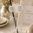 Load image into Gallery viewer, Personalised baby name paper straw toppers in black and white colors in a glass for baby shower celebrations.
