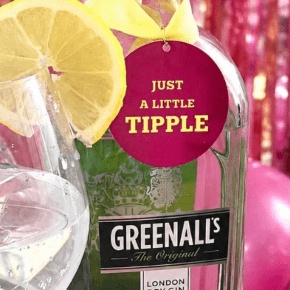 Just A little Tipple Bottle Charm Gift Tag on a bottle with a glass of sparkling beverage and lemon slices.