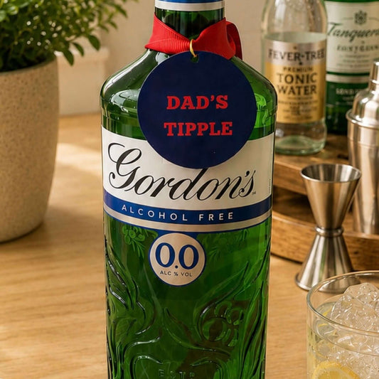 Personalised Father’s Day Text & Message Bottle Charm Gift Tag on a bottle of Gordon's Alcohol Free with a red ribbon.