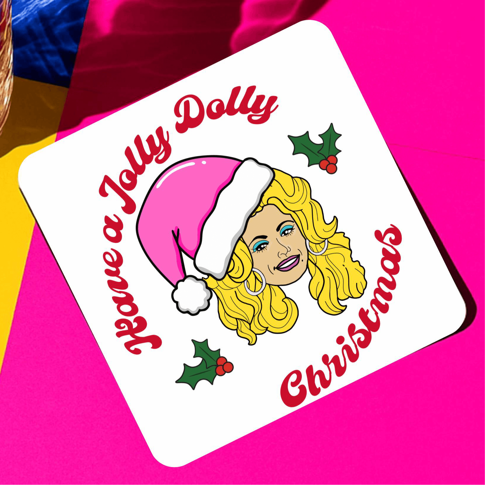 Have a jolly dolly Christmas drink coaster featuring a festive illustration with holly.