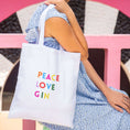 Load image into Gallery viewer, Gin tote bag featuring colorful 'Peace Love Gin' text, ideal for grocery trips and expressing love for gin.
