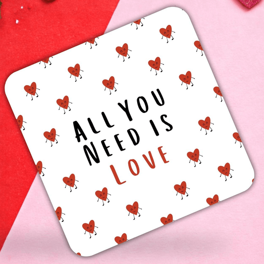 Valentine's Day coasters with charming hearts and text 'All You Need Is Love' for romantic celebrations.