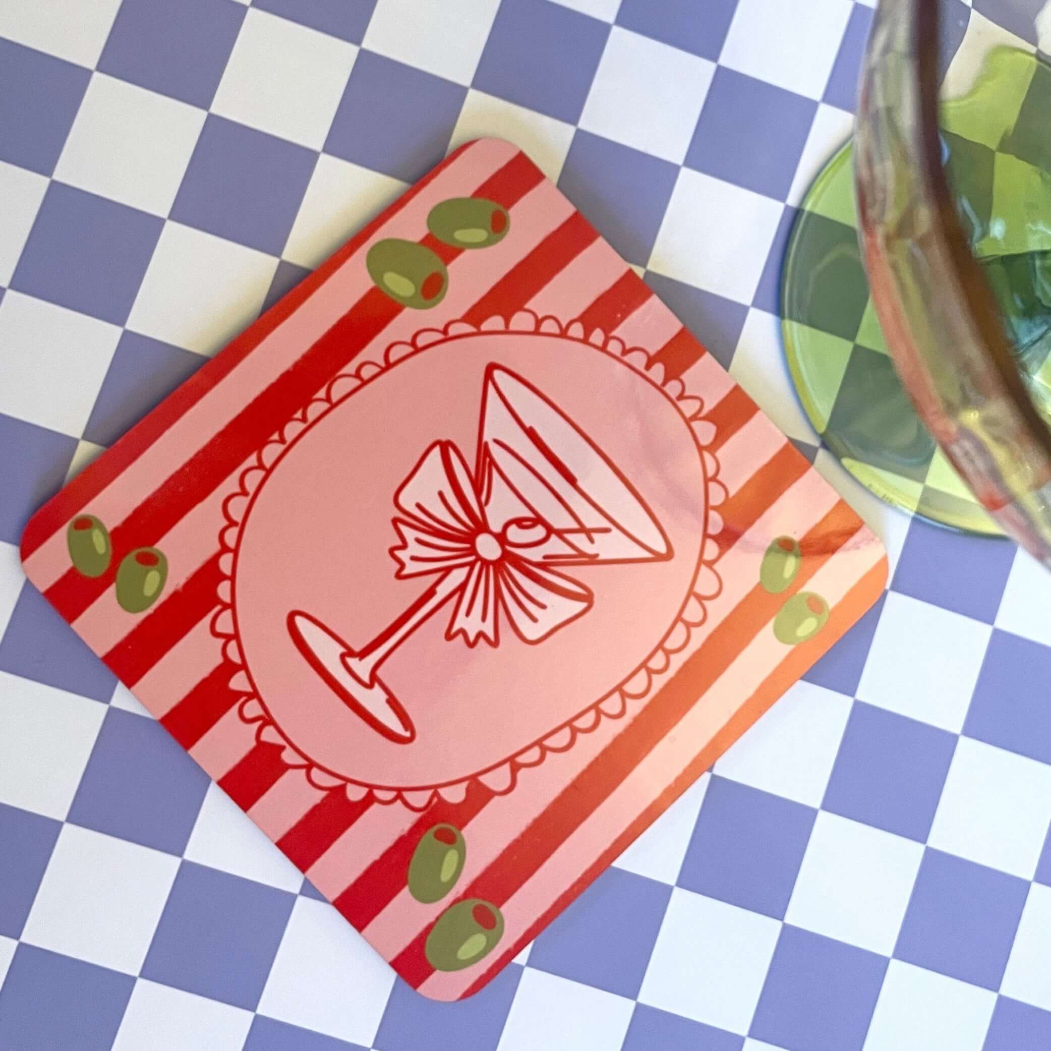Cocktail Time Drink Coaster featuring a vibrant martini glass design with olives on a striped background.